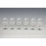 A set of six etched wine glasses in the style of Rowland Ward, each etched with a different