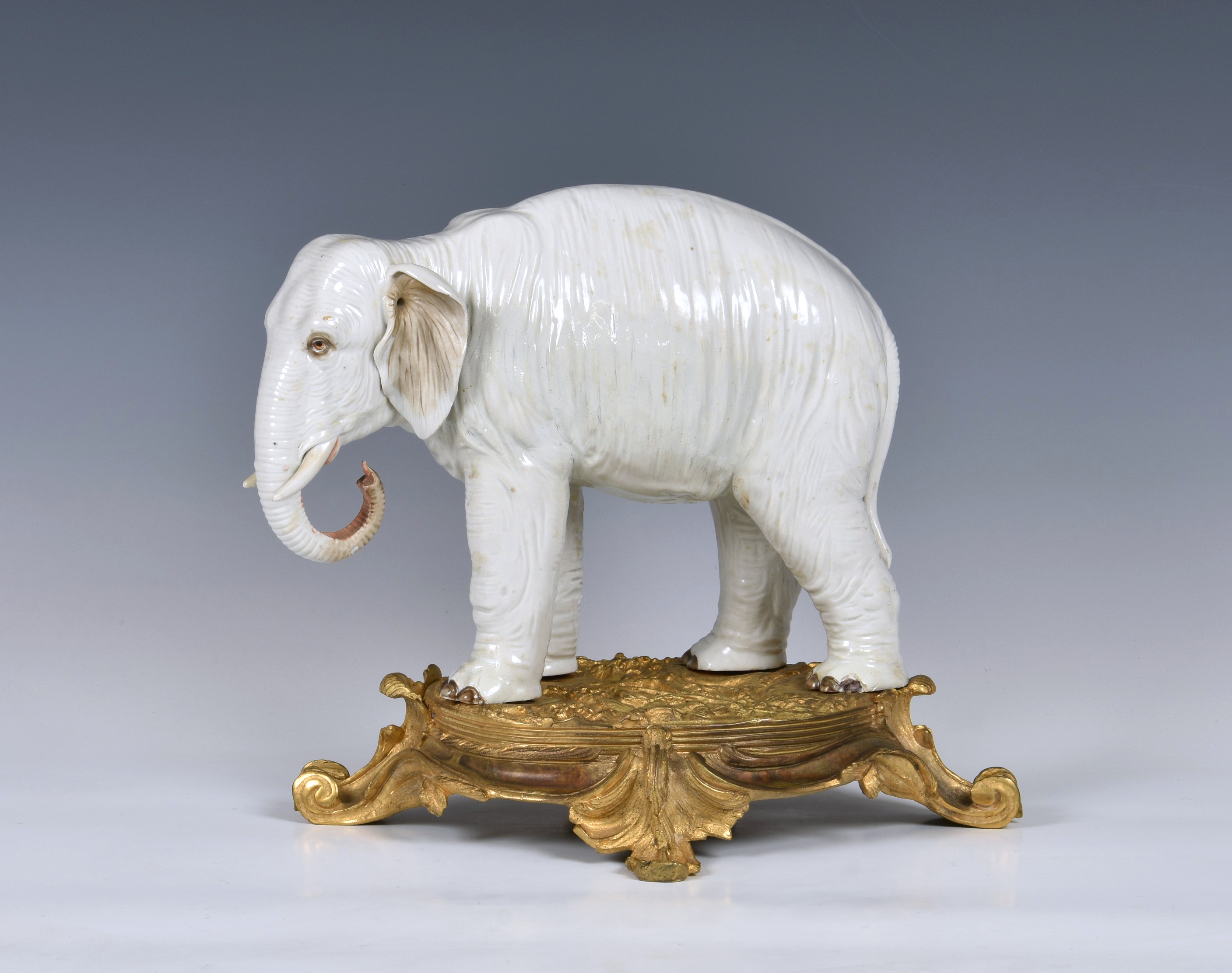 An ormolu mounted Sampson white porcelain elephant , after Meissen, 19th century, realistic