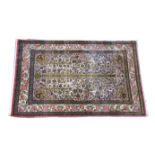 A modern Qum tree of life rug, on ivory ground, with foliate spandrels and repeating saw-tooth,