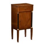 A French Empire style cherry wood, ebonised and parcel gilt bedside cabinet, early 19th century,