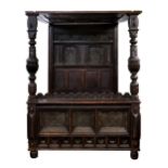 A Charles II and later carved oak full tester bed, probably Yorkshire, the tester with nine