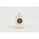 A small Austrian porcelain cased mantel clock, early 20th century, printed factory mark to