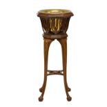 An Edwardian mahogany and marquetry basket top jardinière stand, the octagonal moulded top with