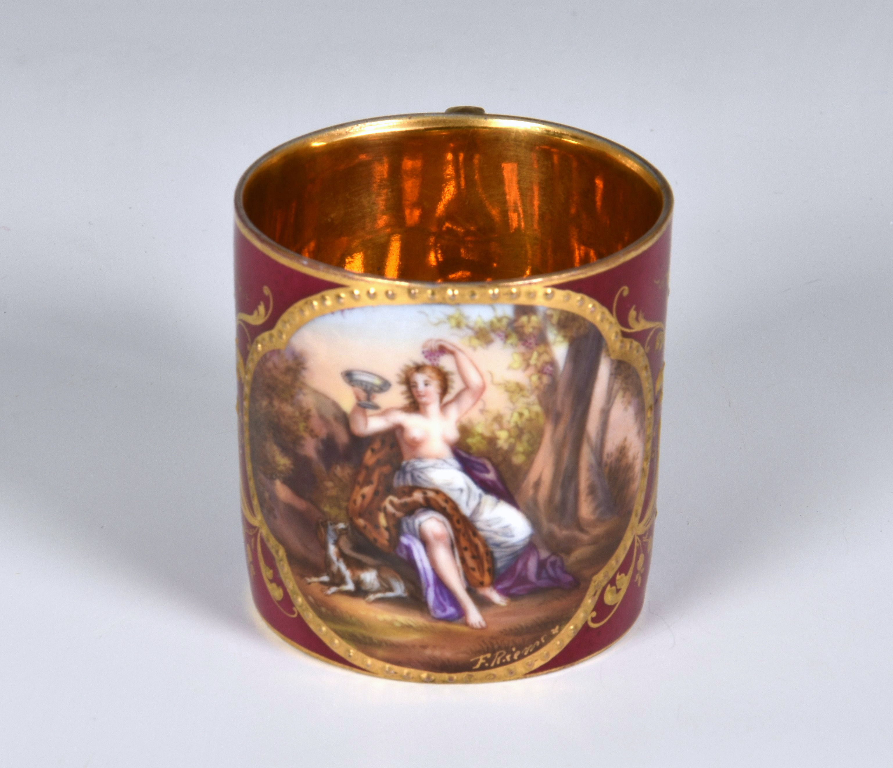 A Royal Vienna porcelain coffee can, late 19th / early 20th century, with a Bacchanalian scene of