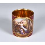 A Royal Vienna porcelain coffee can, late 19th / early 20th century, with a Bacchanalian scene of