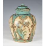 A Chinese covered jar, probably Tang Dynasty (AD 618-907), of slightly shouldered, ovoid form,