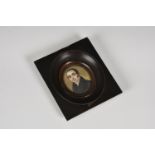 C. Gilbert (English, 19th century), A portrait miniature of a gentleman, in a black coat, oval,