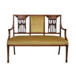 An Edwardian mahogany and satinwood salon settee, the rectangular padded back with two pierced, swag