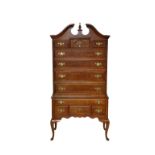 An American Queen Anne style bonnet top highboy by Bernhardt, the moulded bonnet top over two faux