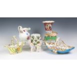 A collection of antique ceramics, to include a porcelain cornucopia vase with a swan terminal,