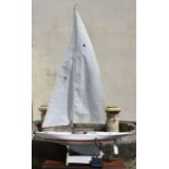 A large pond yacht 'ITHNAYN', having weighted keel, white with red trim, white formica laminate