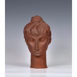 A rare Guernsey Pottery terracotta female bust, signed and dated 'K WEAS 1965 Guernsey Pottery', 8½