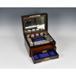 An elegant 19th century coromandel vanity box, the hinged lid opening to reveal fall-front with twin