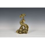 A good quality Victorian cast brass mythical dolphin doorstop,, free standing, 13 ¾in. (35cm.) high.