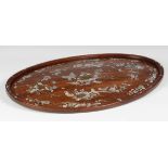 A Chinese oval mother of pearl inlaid hardwood tray, 19th century, inlaid with a central peony and