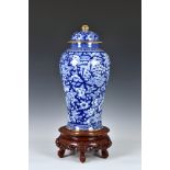 A Chinese style blue and white porcelain covered vase, late 20th century, of baluster form,