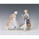A Lladro figurine 'A Warm Welcome', modelled as a girl and dog, printed and stamped marks, 10in. (