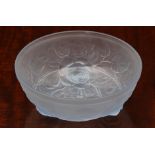 A blue frosted glass bowl in the style of Lalique, with raised decoration of leaves and stems and