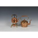 An unusual copper and brass teapot, having applied brass decoration, the inner with stone base, 9