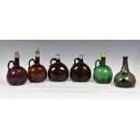 Collection of nineteenth century coloured glass spirit flagons and bottles, to include pair of