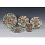 Four Chinese Canton famille rose plates and a teapot, late 19th / early 20th century, comprising a