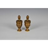 A pair of polished bronze gilt amphora finials, probably from a bedstead or similar, attached by