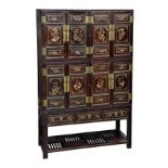 A Chinese gilt decorated black lacquered elm wood compound cabinet, probably Qing Dynasty, mid-