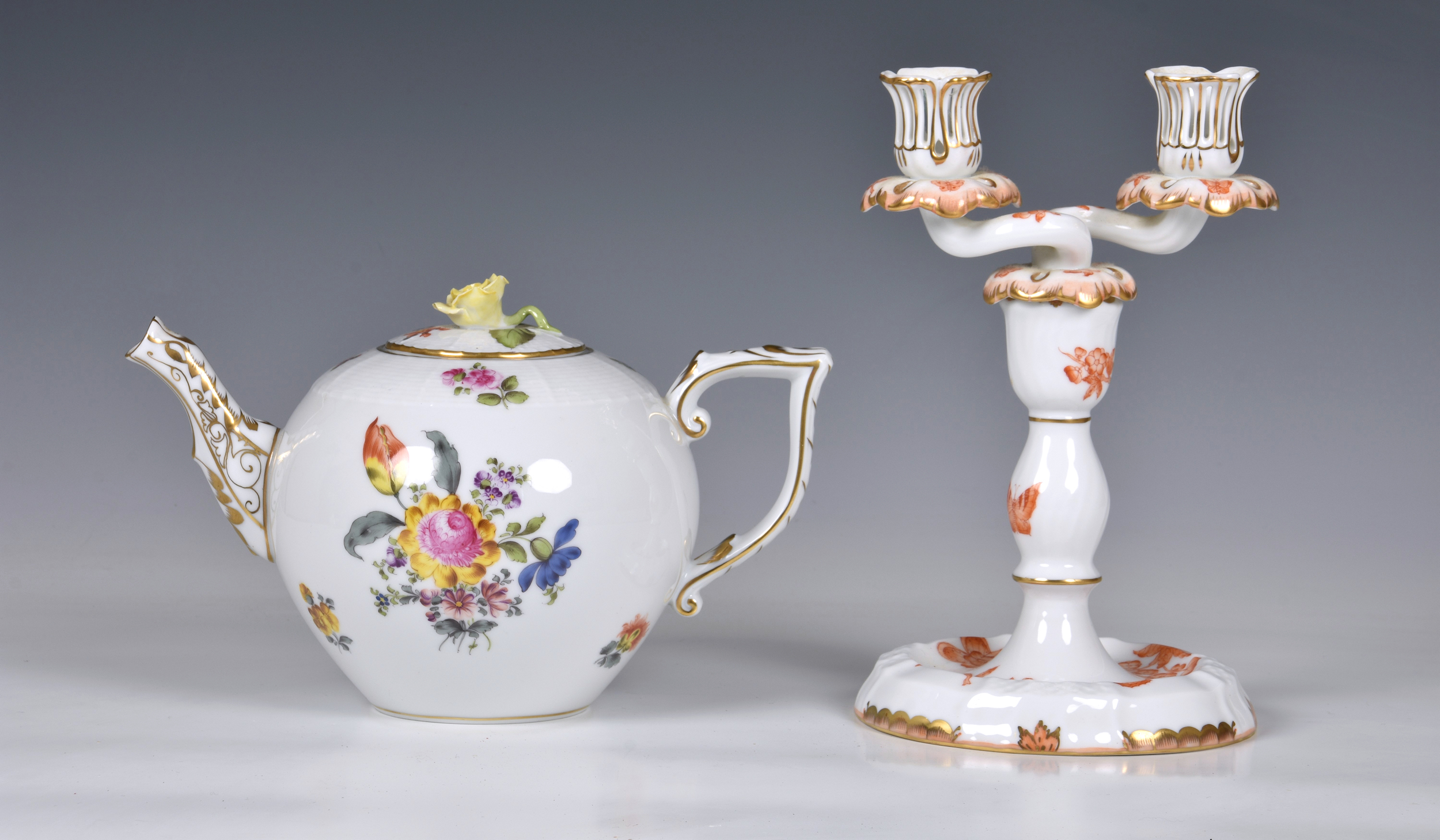 A Herend Teapot, white glaze with hand painted floral design and gilded decoration to handle and