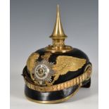 A First World War style German /Prussian pickelhaube with 1813 iron cross and applied suum cuique