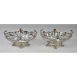 A pair of Edwardian pierced silver bon-bon baskets, Josiah Williams & Co., London 1911, retailer's
