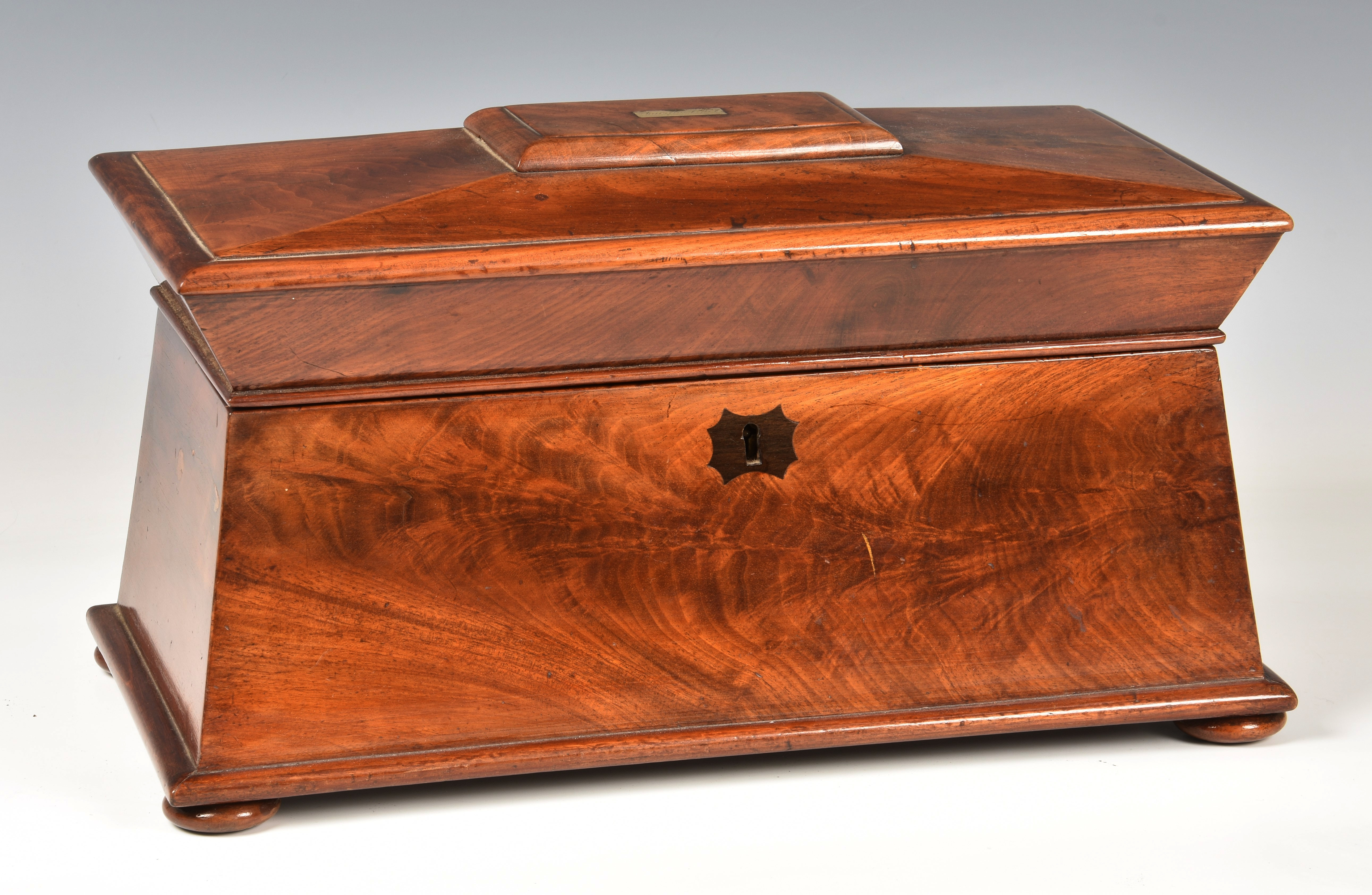 A mid-19th century mahogany tea caddy, of sarcophagus form, with VR lock plate and inlaid