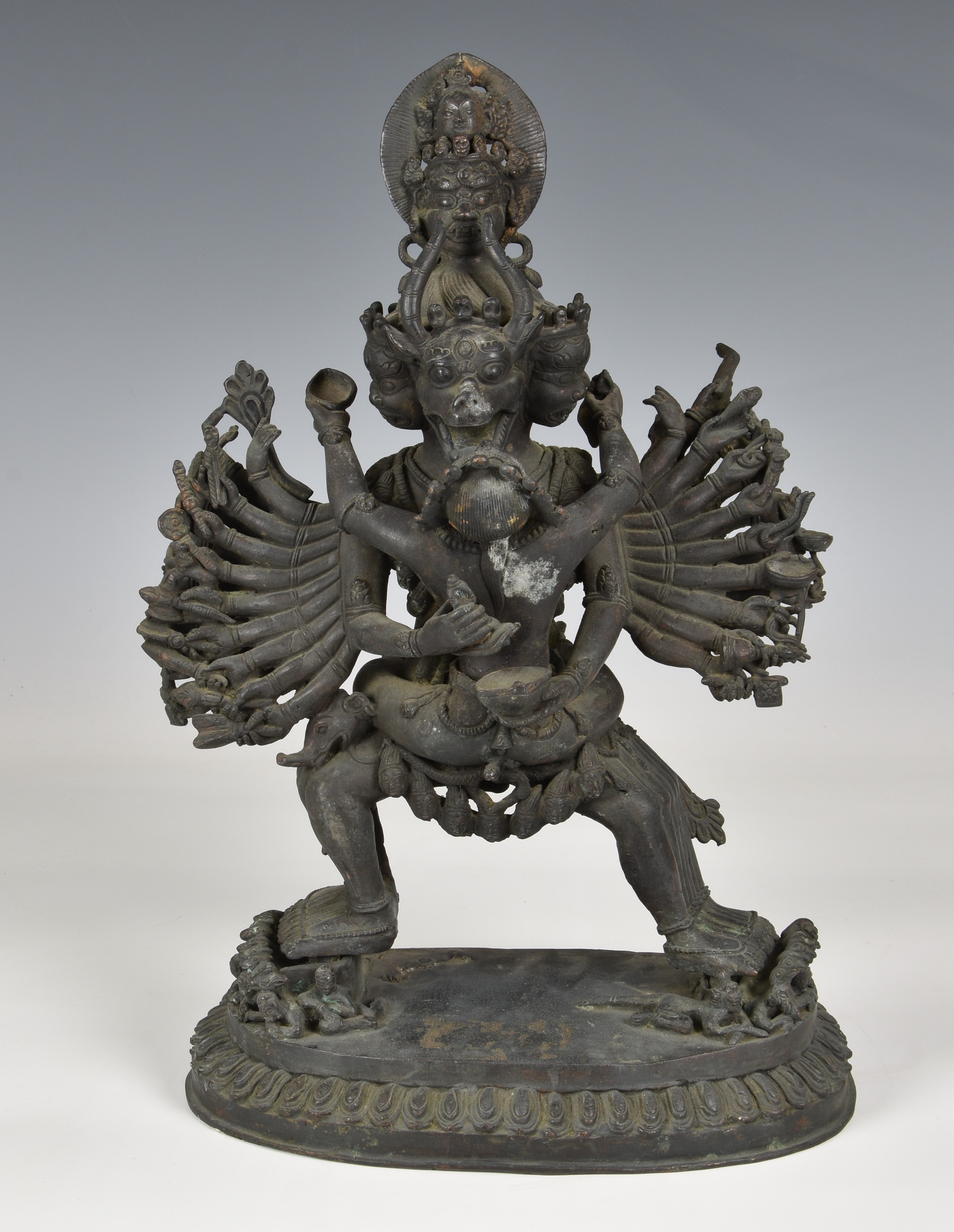 A Chinese patinated bronze figure of Kapaladhara Hevajra, 20th century, the deity depicted with