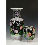 A Chinese porcelain black ground large baluster vase, second half 20th century, painted in famille