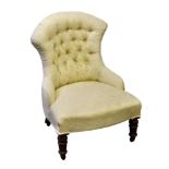 A Victorian button back nursing chair upholstered in ivory damask, raised on turned walnut front