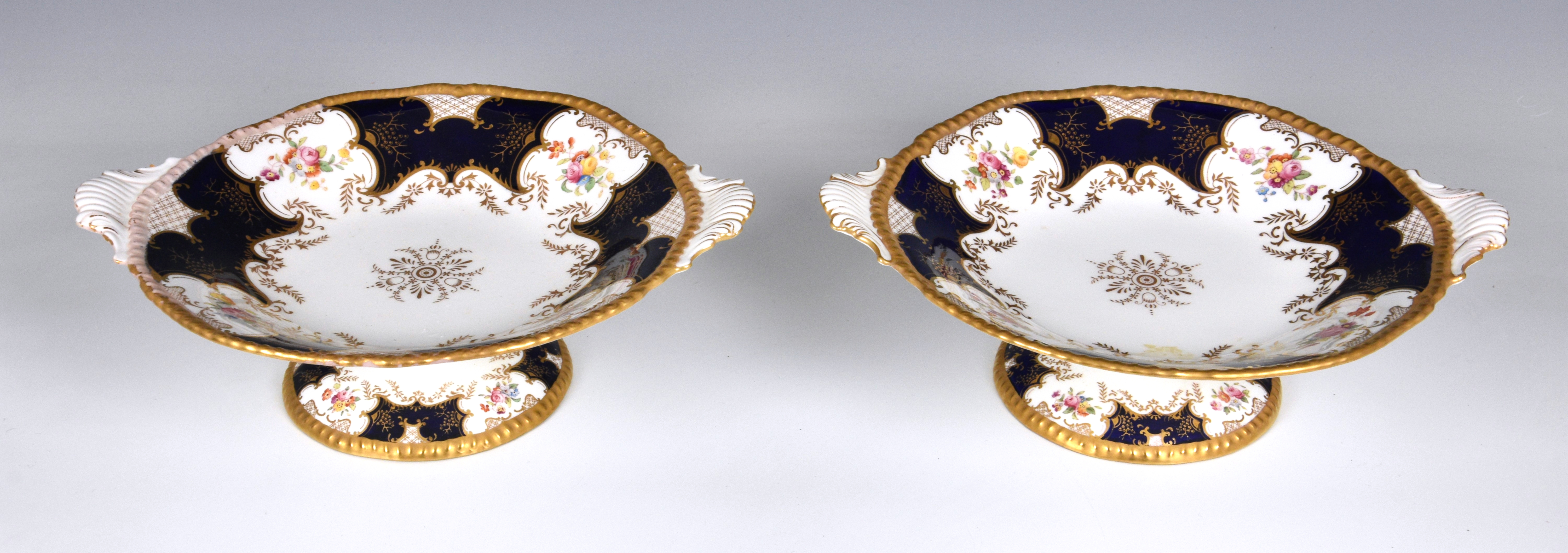 A pair of English Coalport tazzas, of shaped circular form with twin moulded handles, royal blue and