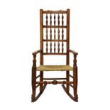 A George III turned oak and ash spindle back rocking chair, the back with three rows of turned
