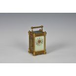 A French miniature gilt brass carriage timepiece, late 19th century, the ornate column case with
