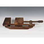 A large antique / vintage wood block vice, 29in. (73.7cm.) long.