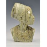 A carved greenstone bust of a young African woman, unsigned, late 20th century, 11¼in. (28.5cm.)