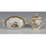 A Berlin porcelain two-handled chocolate cup and cover, finely painted with two scenes in gilded