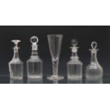 Four Georgian glass decanters, 10¾in. to 12in. (27.25cm. to 30.5cm.) high, some faults, two later