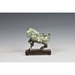 A carved Jade horse with Hong Kong horse racing interest, the Tang style horse, sitting upon a