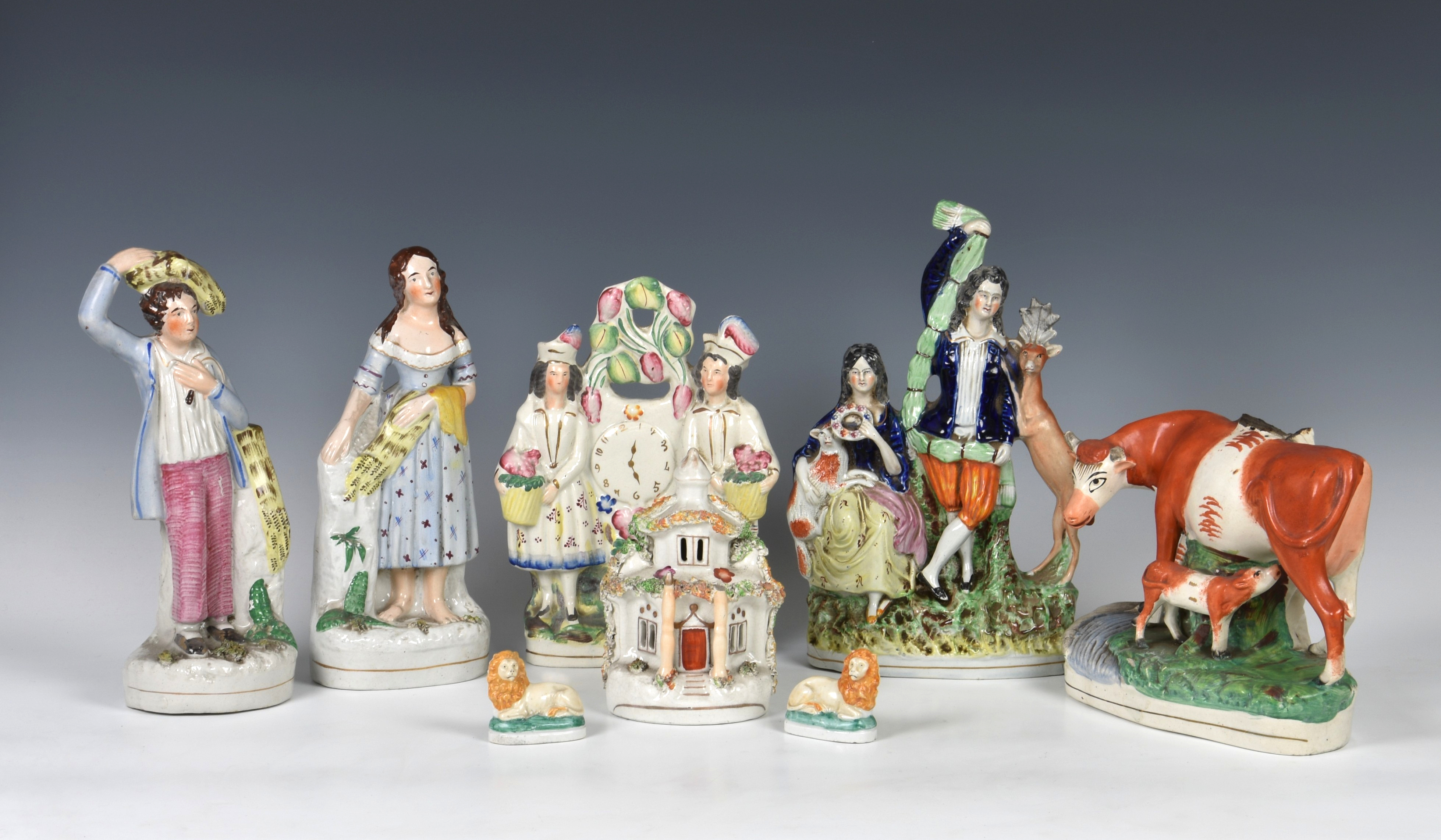 A collection of Staffordshire Pottery flat back figures and others, of varying sizes and models,