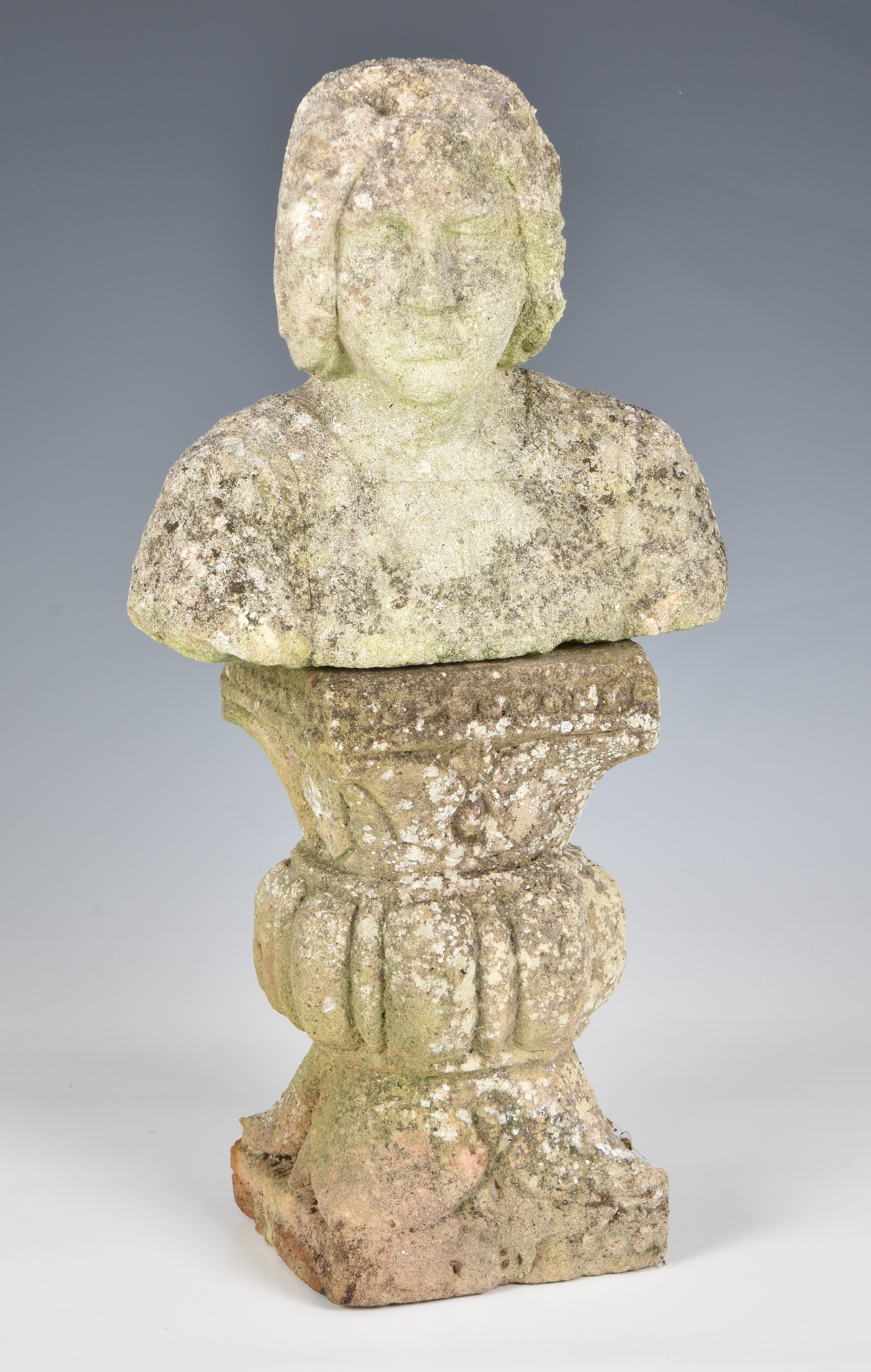 A composite stone bust on a pedestal base, 15½in. (39.4cm.) high. (2)