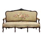 A 19th century carved rosewood serpentine settee, the serpentine back carved with flowers and