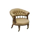 An Edwardian tub chair with silk upholstery, the buttoned back over a gallery with rosette carved