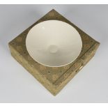 A Chinese monochrome white glazed porcelain bowl, probably 20th century, the shallow circular bowl