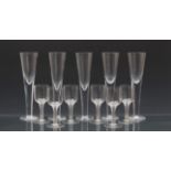 A set of five unusual oversized blown glass champagne flutes, probably third quarter 20th century,