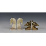 A pair of onyx horse head bookends, 8 3/8in. (21.3cm.) high, together with a pair of brass eagle