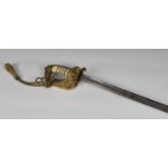 A late Victorian Naval dress sword, with wire bound shagreen handle, lion pommel and brass hand